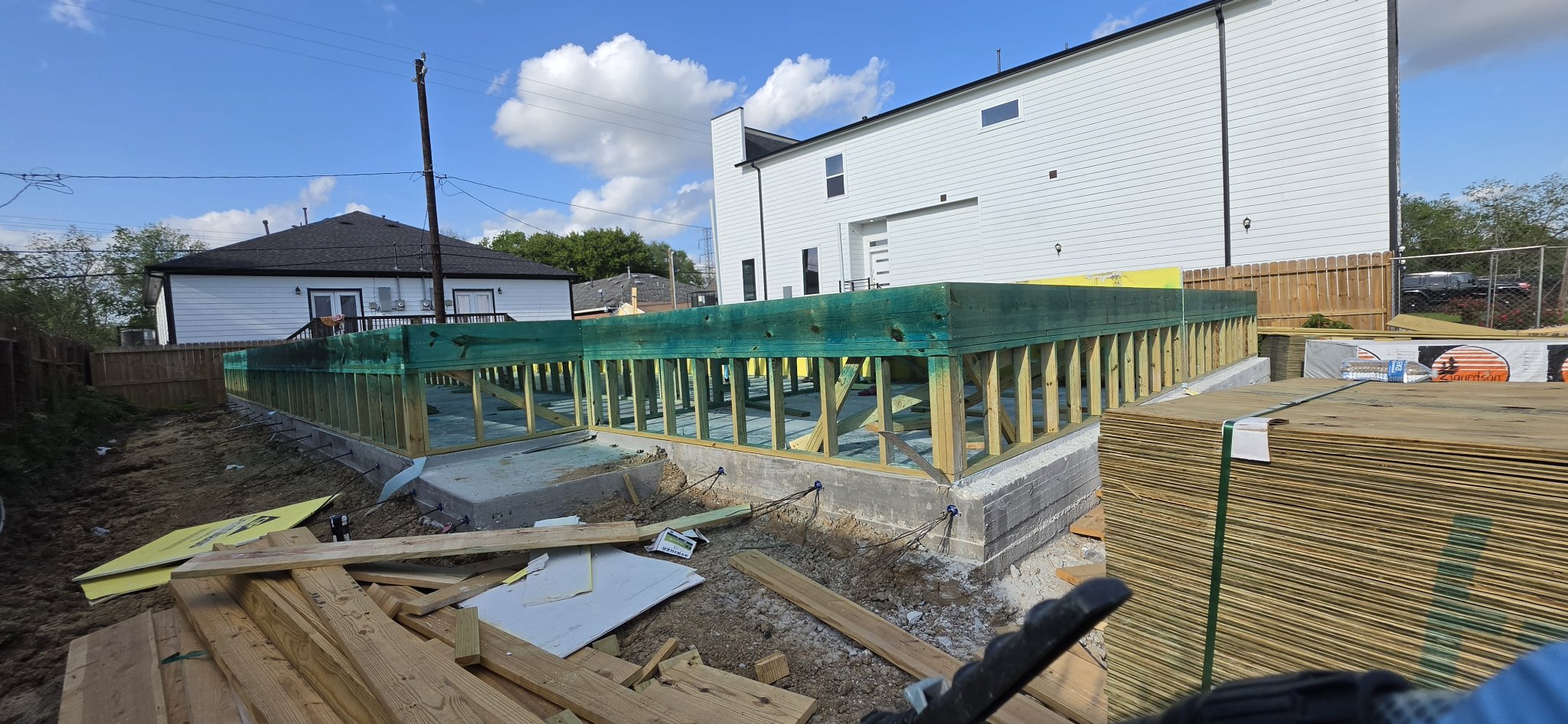 New construction foundation with exposed slab edges, joints and plumbing entries